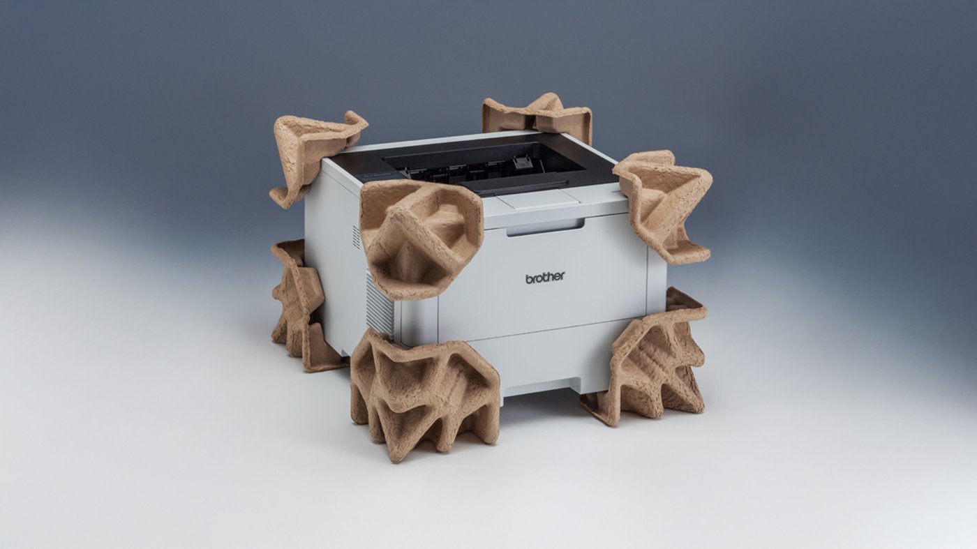 Brother printer protected with recyclable molded pulp packaging as part of eco friendly EPS free shipping materials.