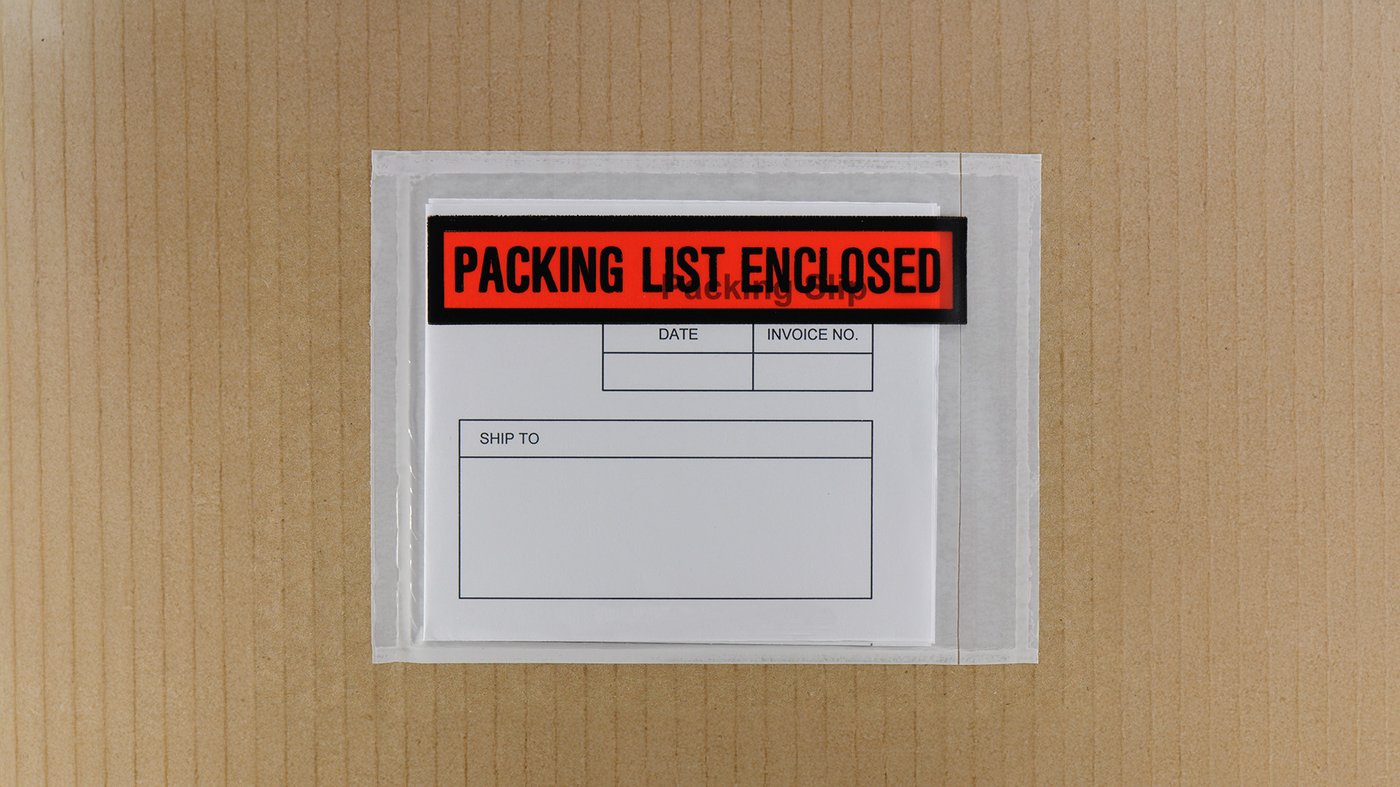 A packing list envelope labeled Packing List Enclosed is attached to a cardboard box, showing a blank shipping form inside.