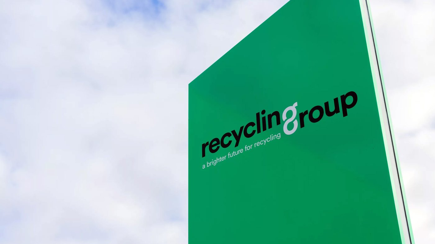 Recycling Group outdoor sign with green branding and tagline promoting sustainable recycling solutions.