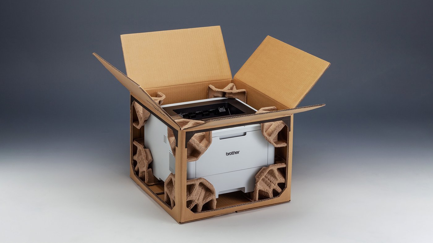 Finished Brother EPS-free packaging using moulded fibre inserts for secure and sustainable printer transport.