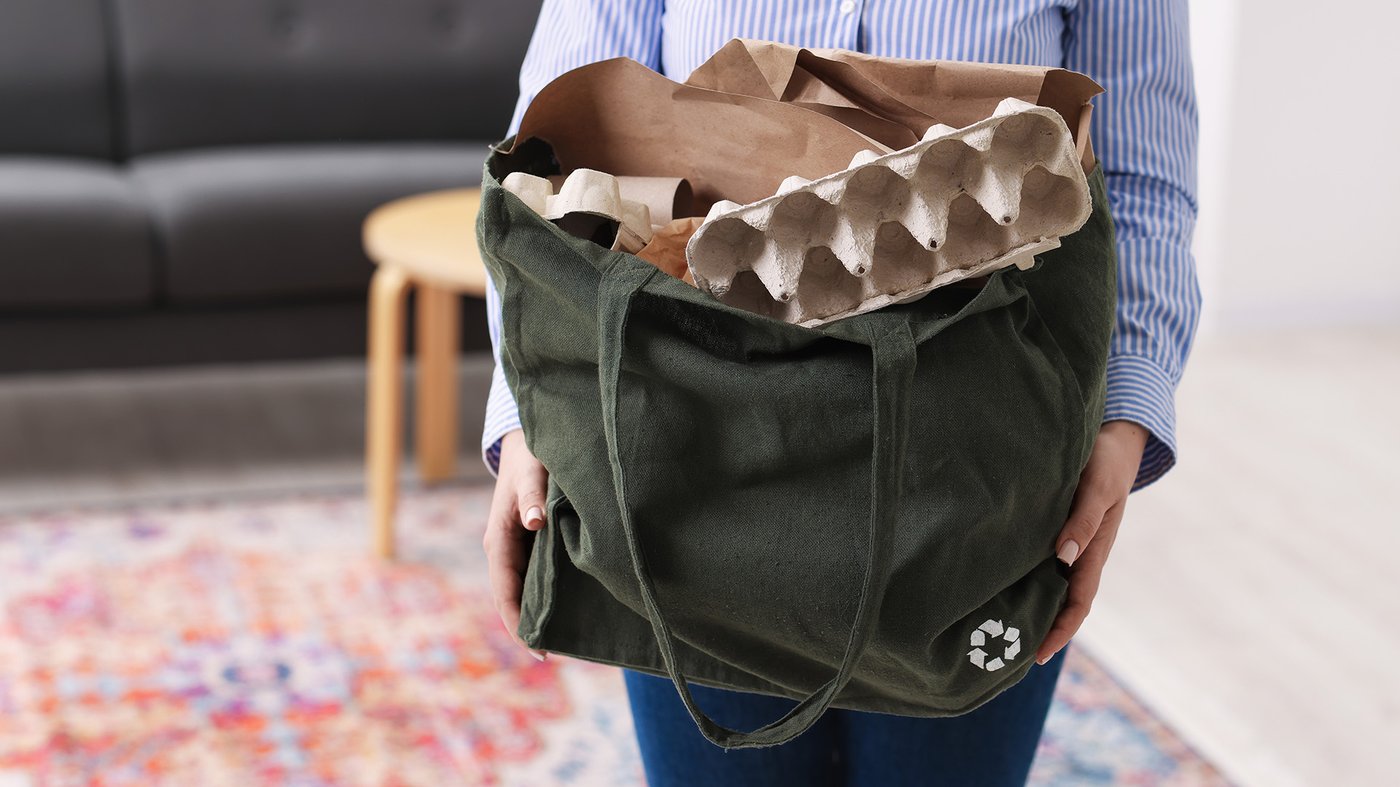 Reusable bag holding recyclable paper and moulded fibre packaging, supporting Brother’s EPS-free and sustainable packaging approach.