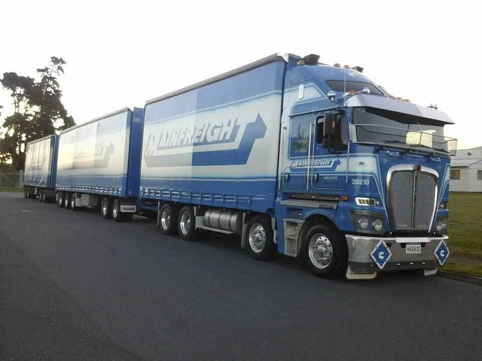 A Mainfreight delivery truck driving on the road