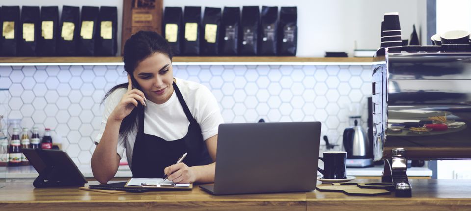 Cafe shop working using laptop