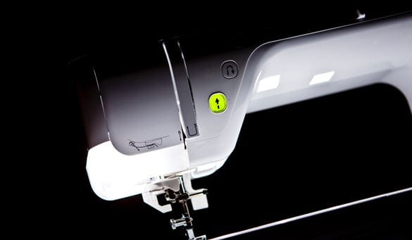 sewing machine on black background